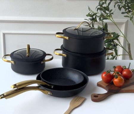 طقم طناجر 5 قطع اسود يد ذهبي